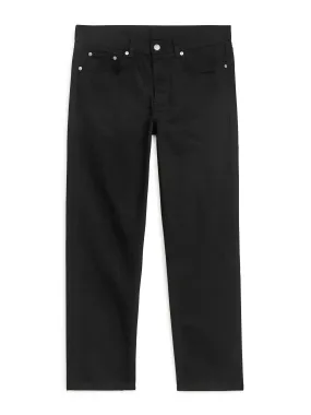 Black cropped straight jeans